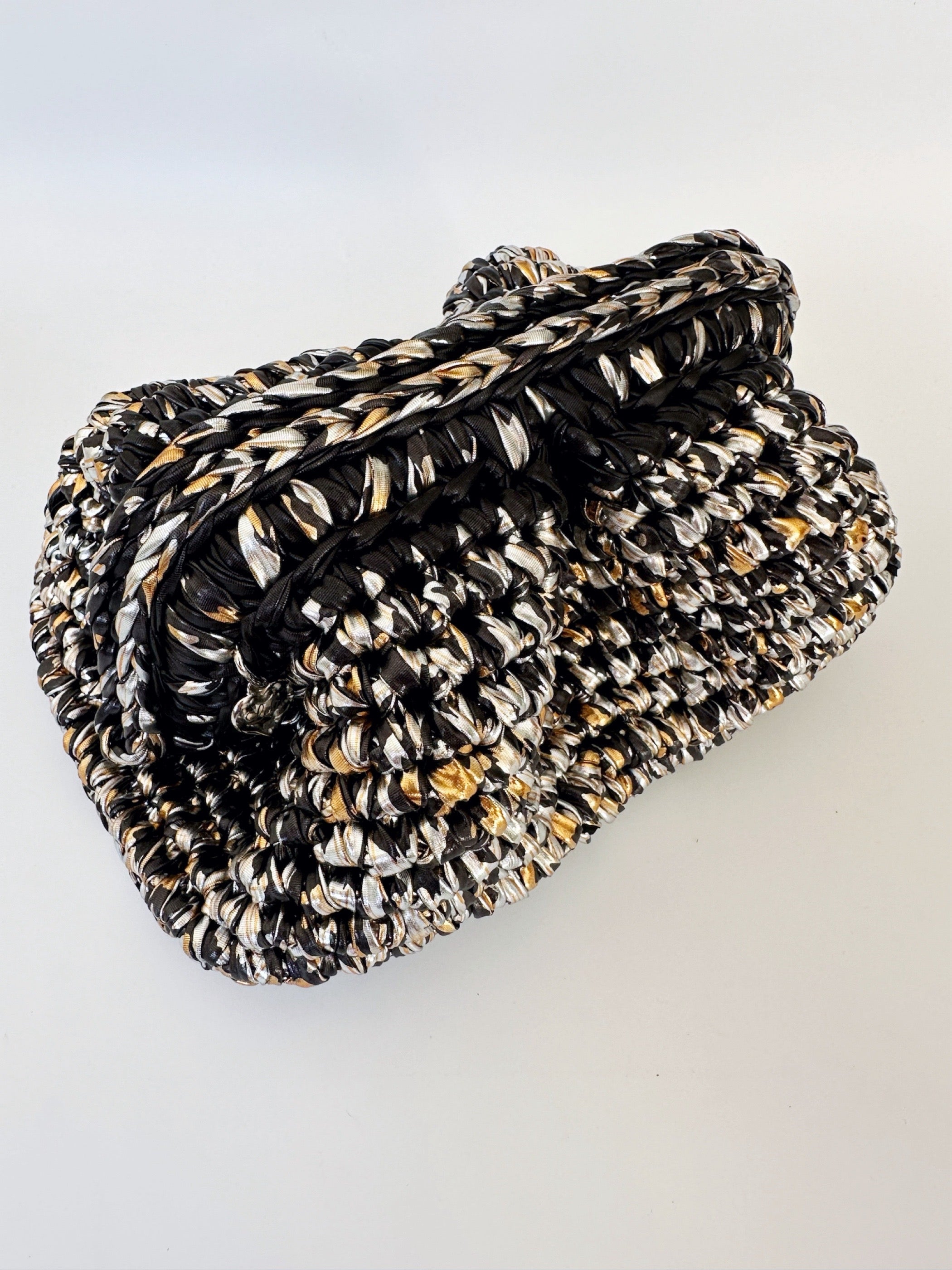 The Lexie Clutch in Snake And Cheetah Cork hot